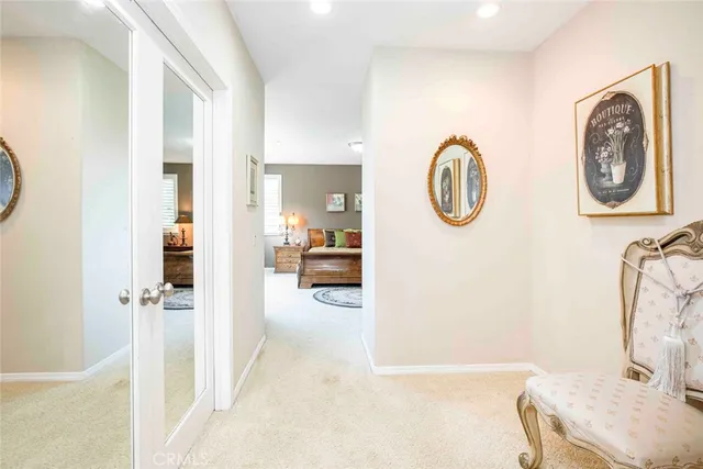 a view of a chair and table in backyard of the house