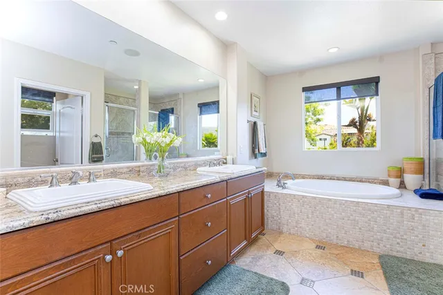 a view of a patio with chairs and plants
