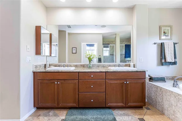 a view of a backyard with sitting area and garden