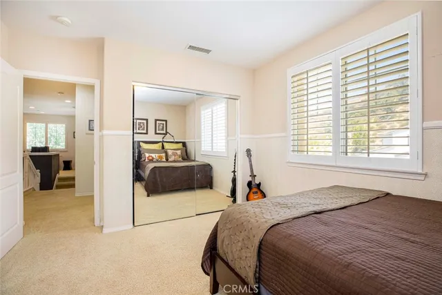 a view of a house with garden and a sitting area
