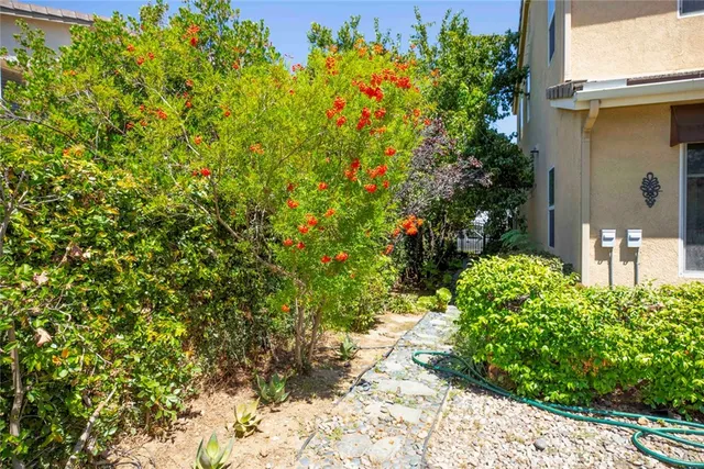 an aerial view of residential house with outdoor space and parking
