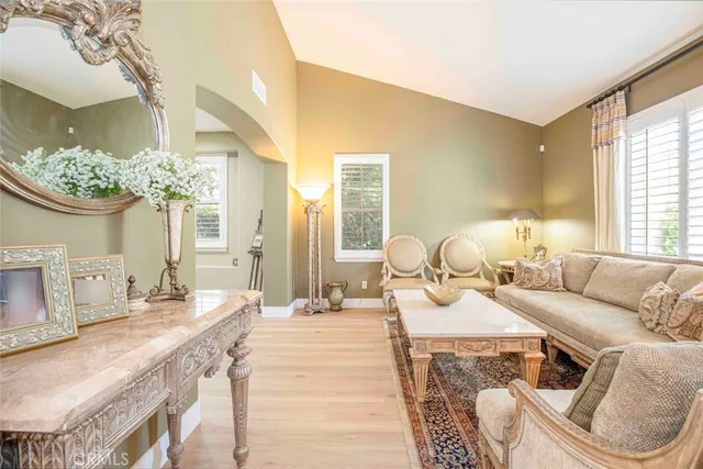 a view of a dining room with furniture and a window