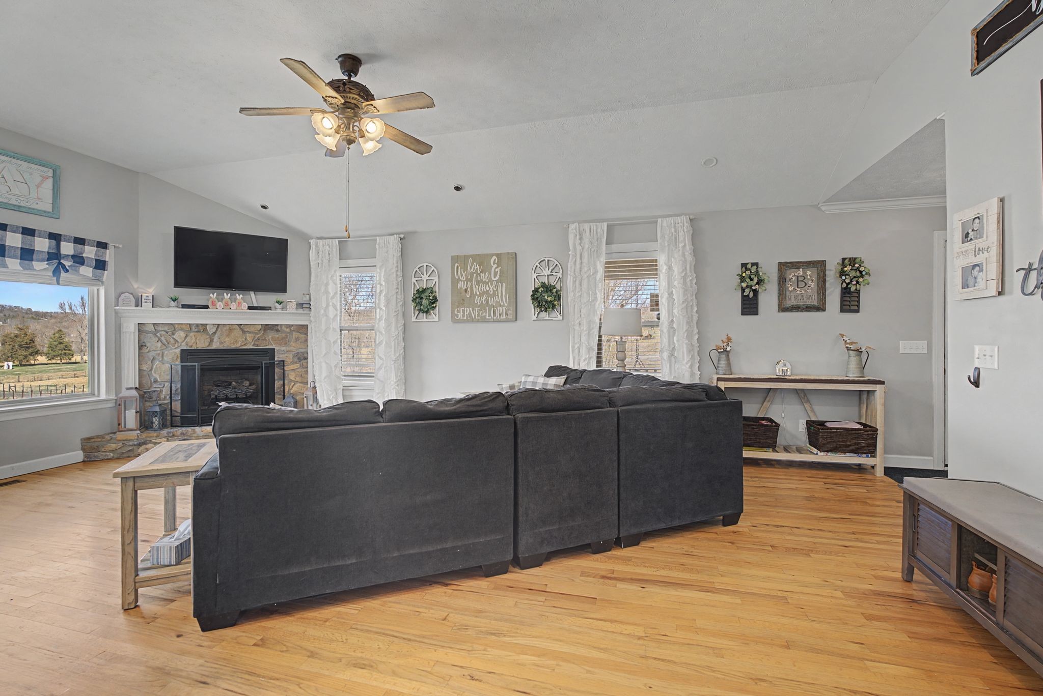 48 Fox Run Lane Carthage, TN 37030 - Photo 14 of 38 a living room with furniture a flat screen tv and a fireplace