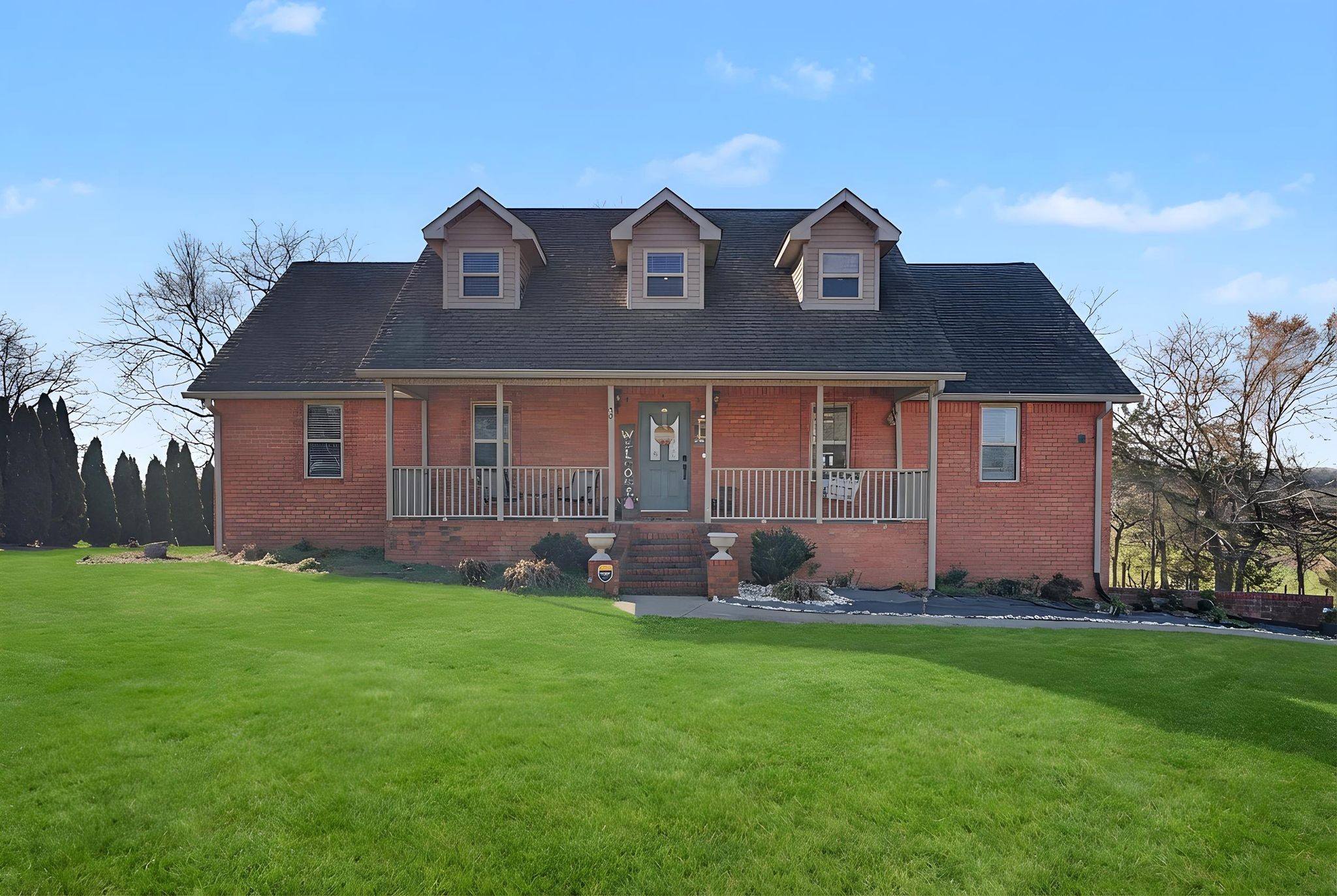 48 Fox Run Lane Carthage, TN 37030 - Photo 2 of 38 a front view of a house with a yard and trees