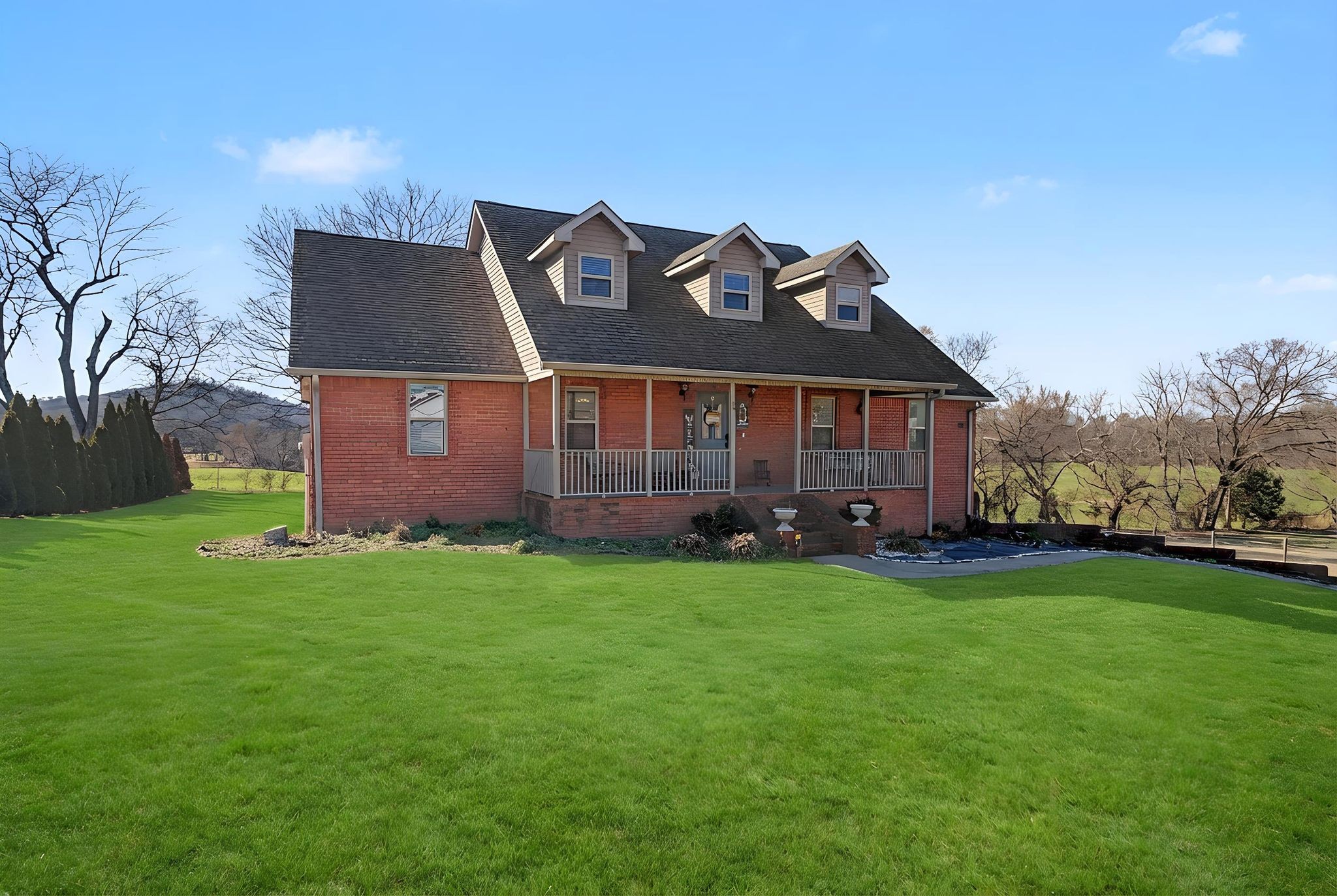 48 Fox Run Lane Carthage, TN 37030 - Photo 2 of 38 a front view of a house with garden
