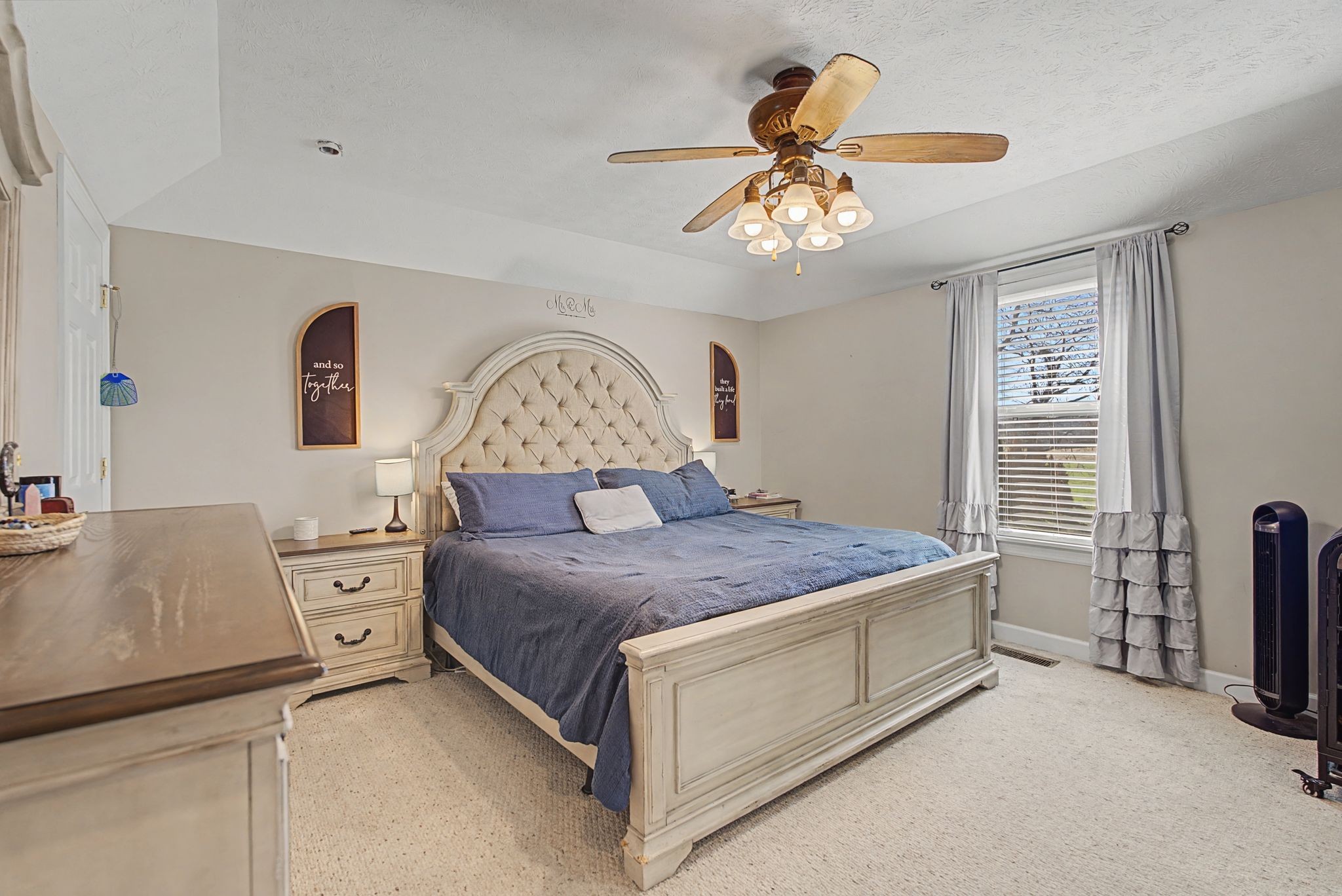 48 Fox Run Lane Carthage, TN 37030 - Photo 23 of 38 a bedroom with a bed and a chandelier