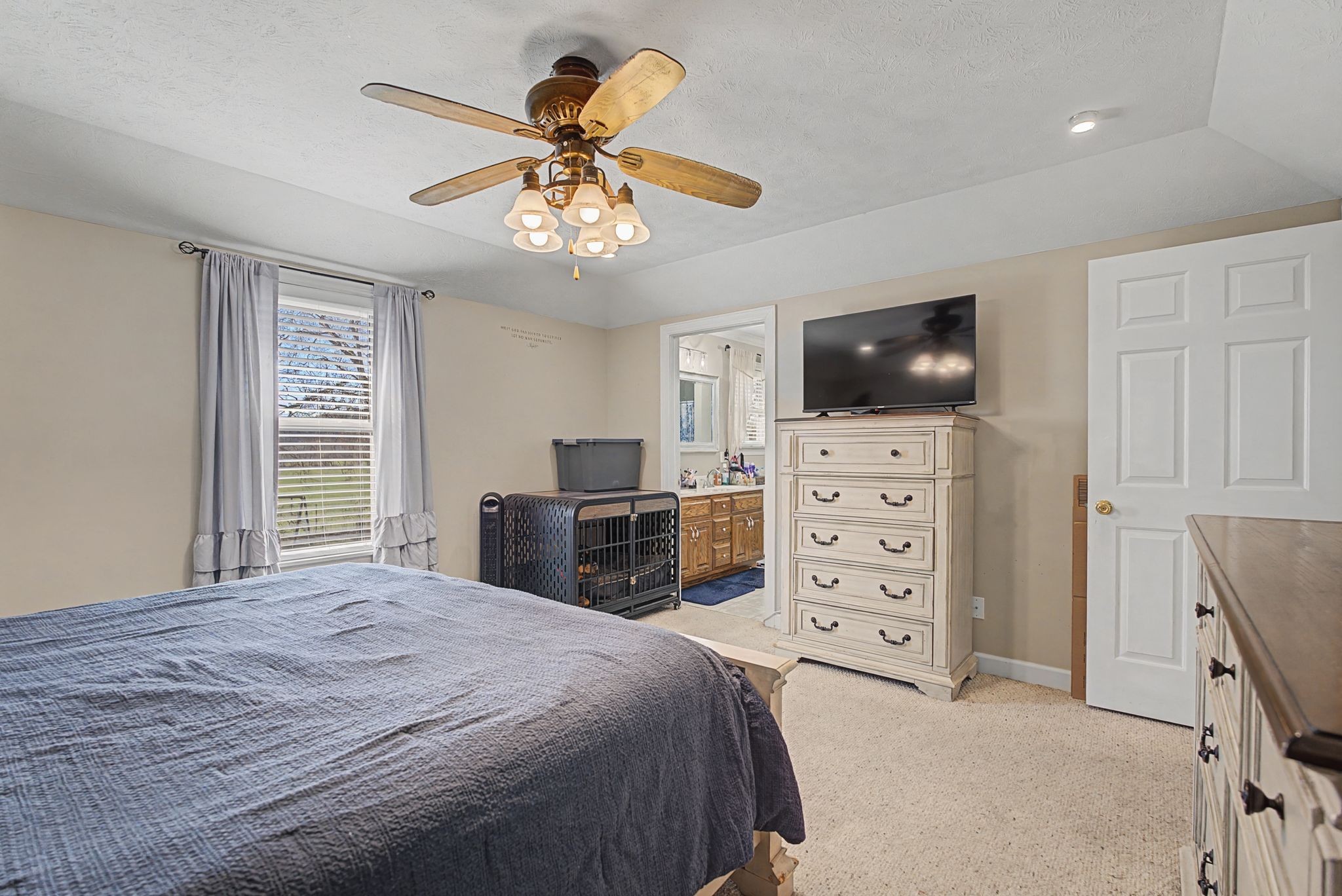 48 Fox Run Lane Carthage, TN 37030 - Photo 24 of 38 a bedroom with a bed and a flat screen tv