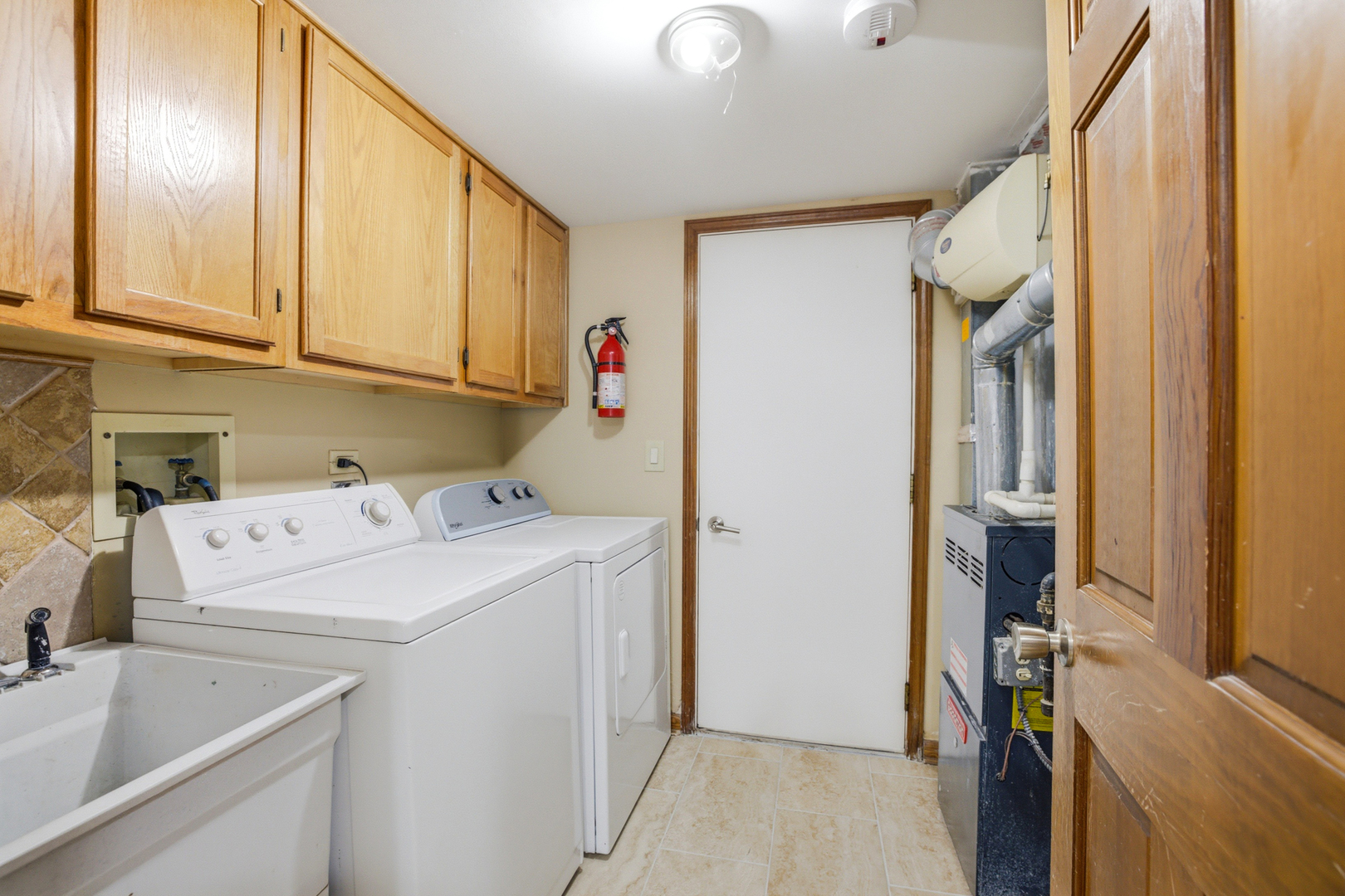 36106 North Springbrook Lane Gurnee, IL 60031 - Photo 15 of 27 a view of storage and utility room with washer and dryer