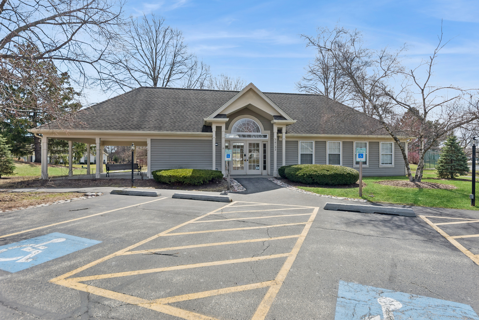 36106 North Springbrook Lane Gurnee, IL 60031 - Photo 26 of 27 a front view of a house with a garden and trees