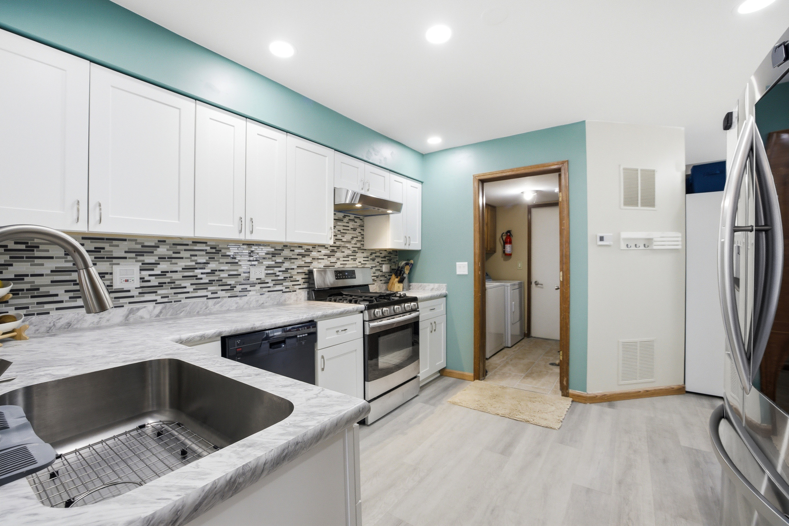 36106 North Springbrook Lane Gurnee, IL 60031 - Photo 8 of 27 a kitchen with a sink cabinets and stainless steel appliances