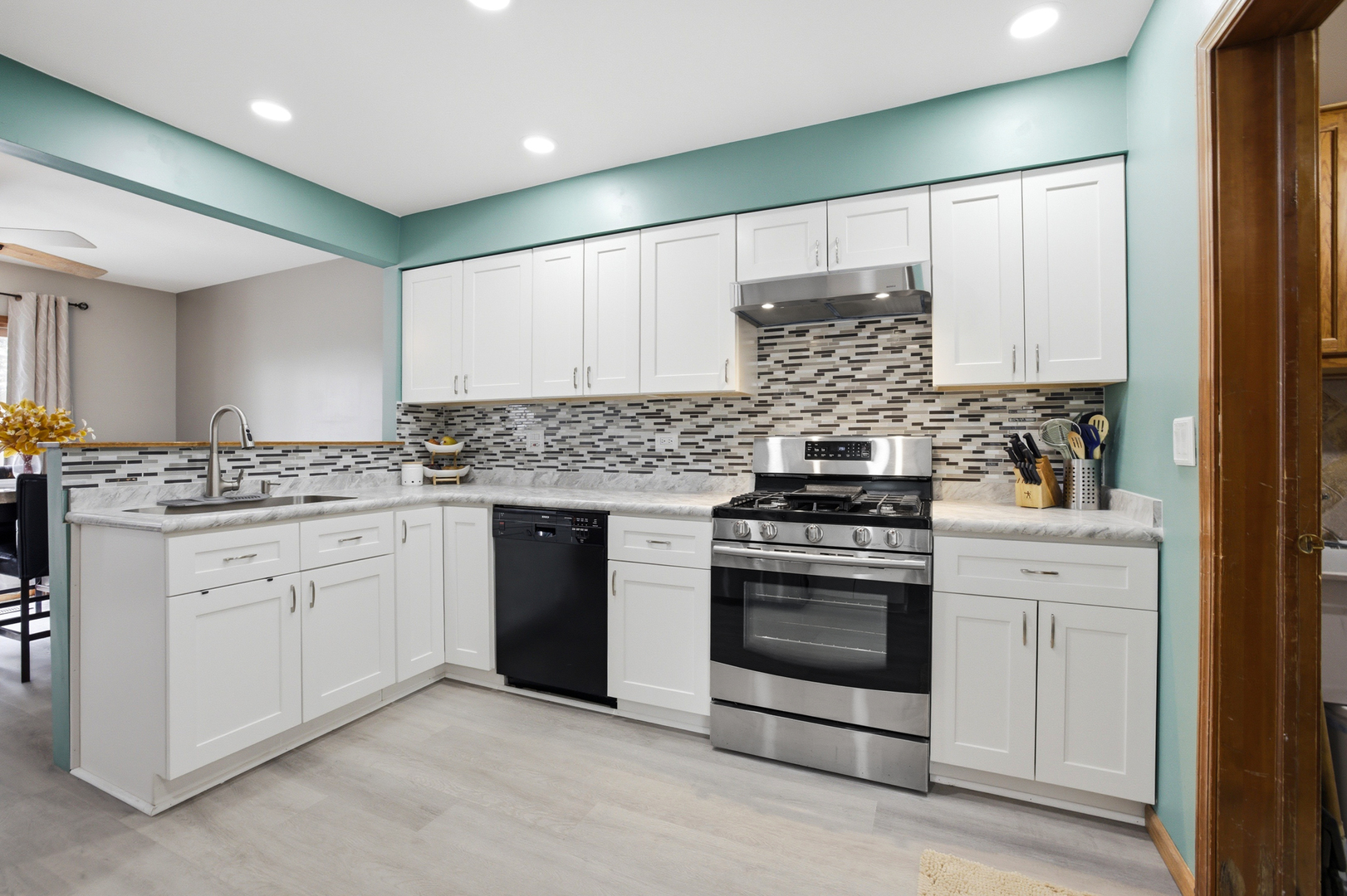 36106 North Springbrook Lane Gurnee, IL 60031 - Photo 9 of 27 a kitchen with granite countertop white cabinets and appliances