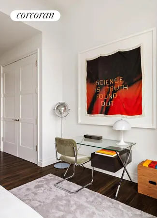 a bedroom with a bed and glass window