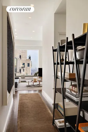 a living room with furniture and a rug