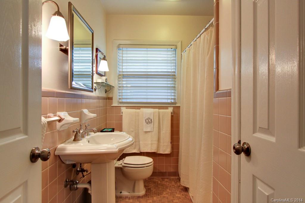 4310 Walker Road Charlotte, NC 28211 - Photo 12 of 16 a bathroom with a sink a toilet and shower
