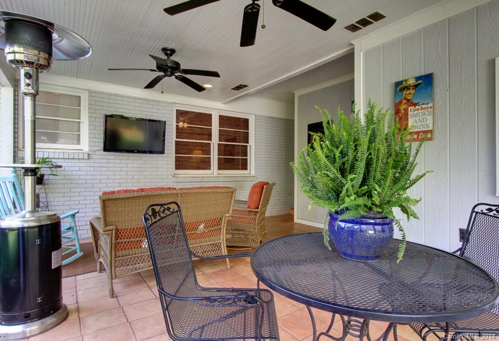 4310 Walker Road Charlotte, NC 28211 - Photo 14 of 16 a dining room with furniture and potted plants