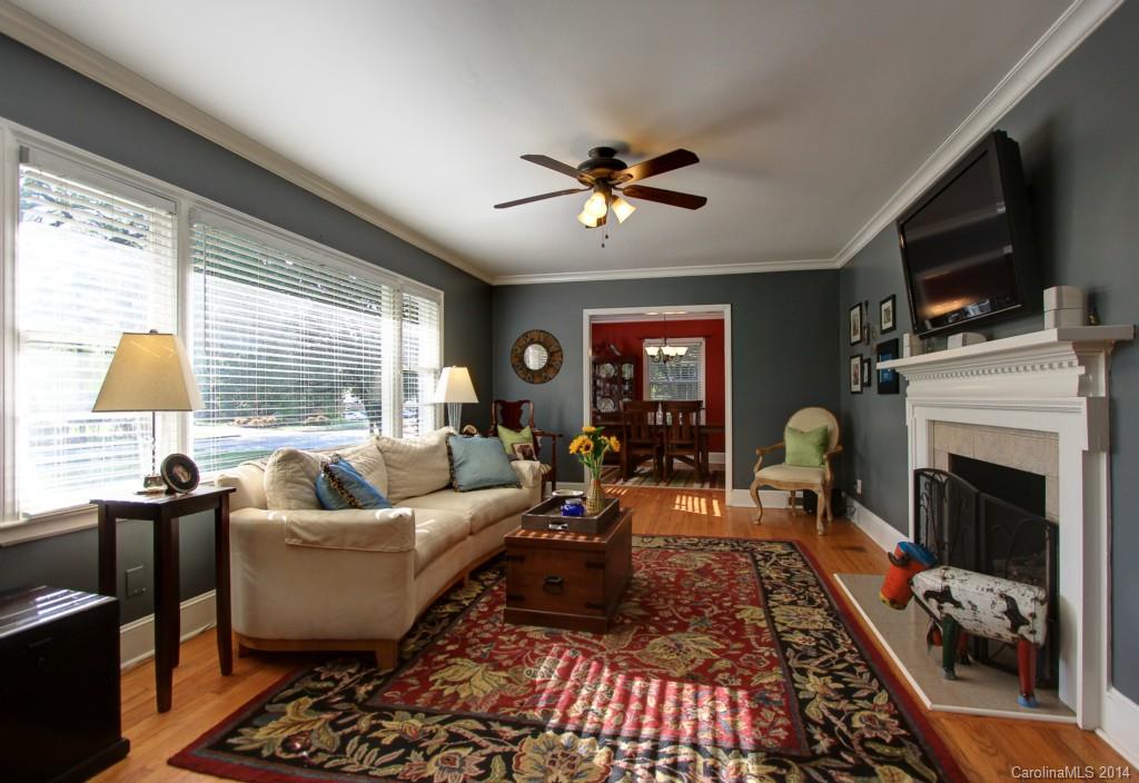 4310 Walker Road Charlotte, NC 28211 - Photo 3 of 16 a living room with furniture fireplace and flat screen tv
