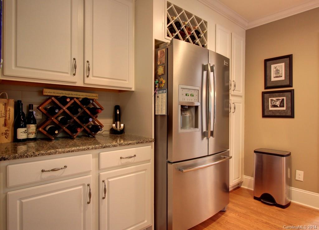 4310 Walker Road Charlotte, NC 28211 - Photo 6 of 16 a kitchen with stainless steel appliances granite countertop a refrigerator and a stove