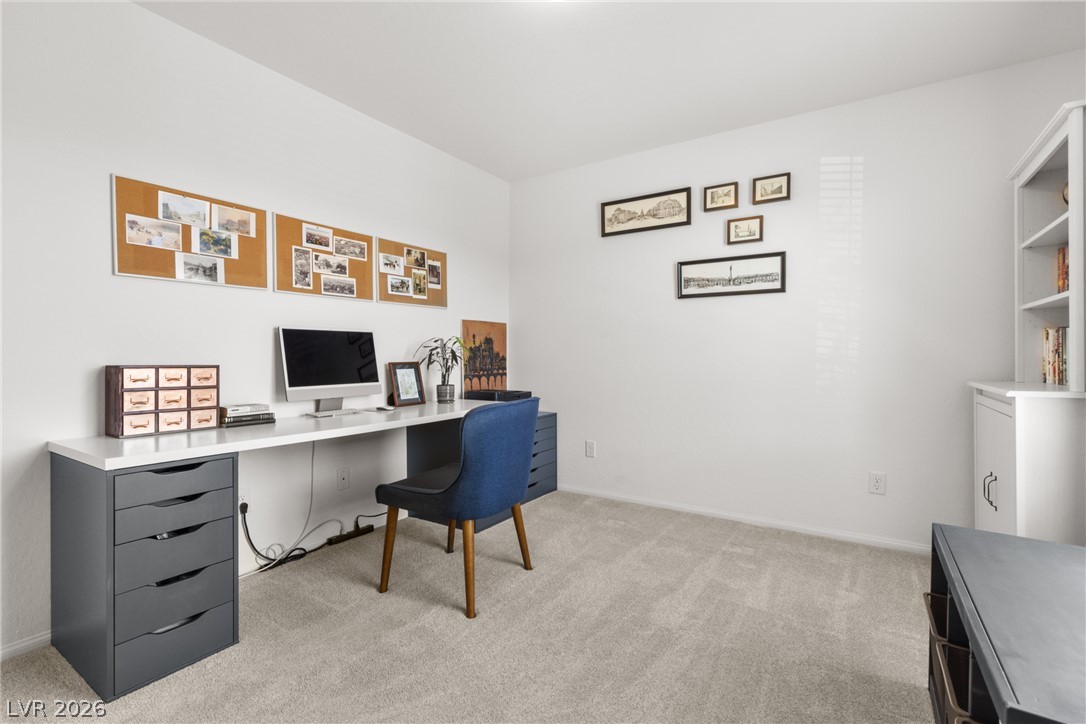 891 Earth Luster Road Las Vegas, NV 89178 - Photo 24 of 48 A dedicated home office space with plush carpeting, perfect for productivity.