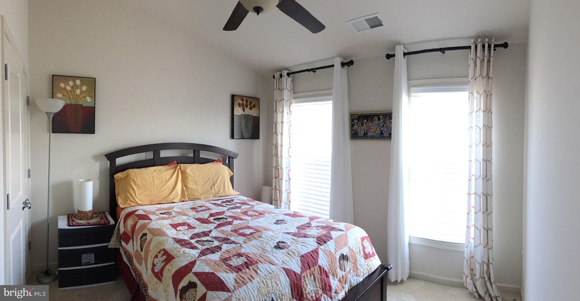 23337 Tradewind Drive Ashburn, VA 20148 - Photo 13 of 28 a bedroom with a bed and a window