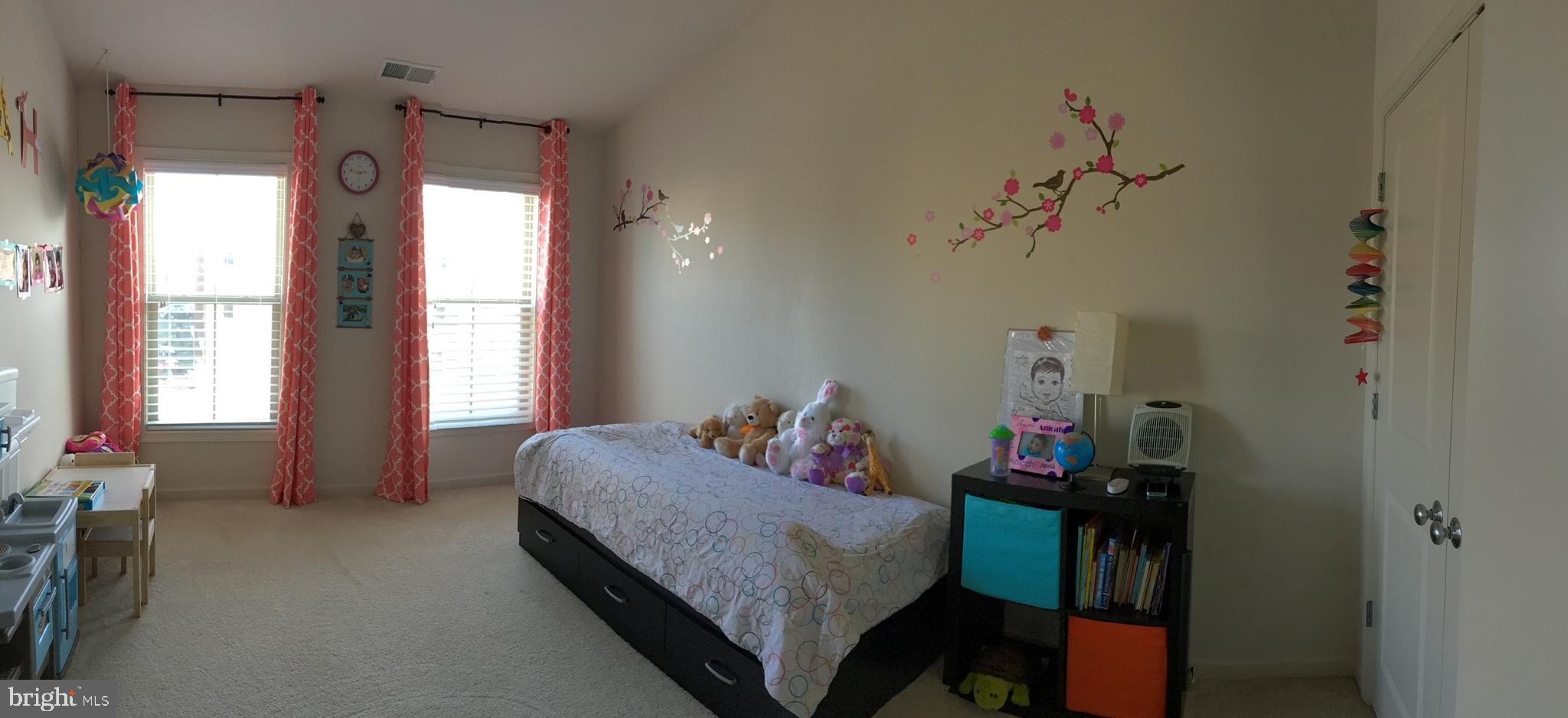 23337 Tradewind Drive Ashburn, VA 20148 - Photo 14 of 28 a bedroom with a bed and a window