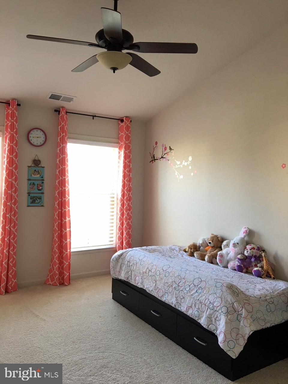 23337 Tradewind Drive Ashburn, VA 20148 - Photo 15 of 28 a bedroom with a bed and window