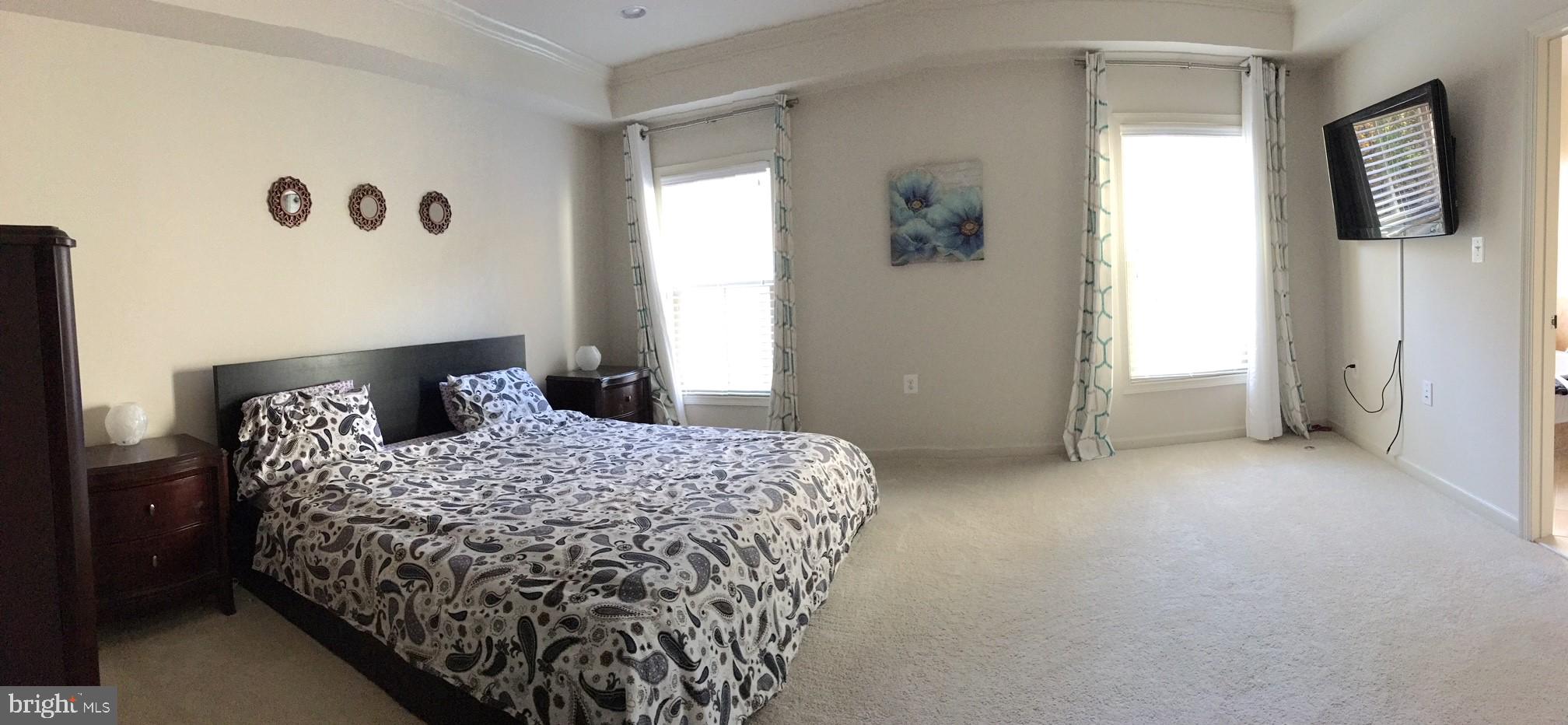 23337 Tradewind Drive Ashburn, VA 20148 - Photo 17 of 28 a bedroom with a bed and a window
