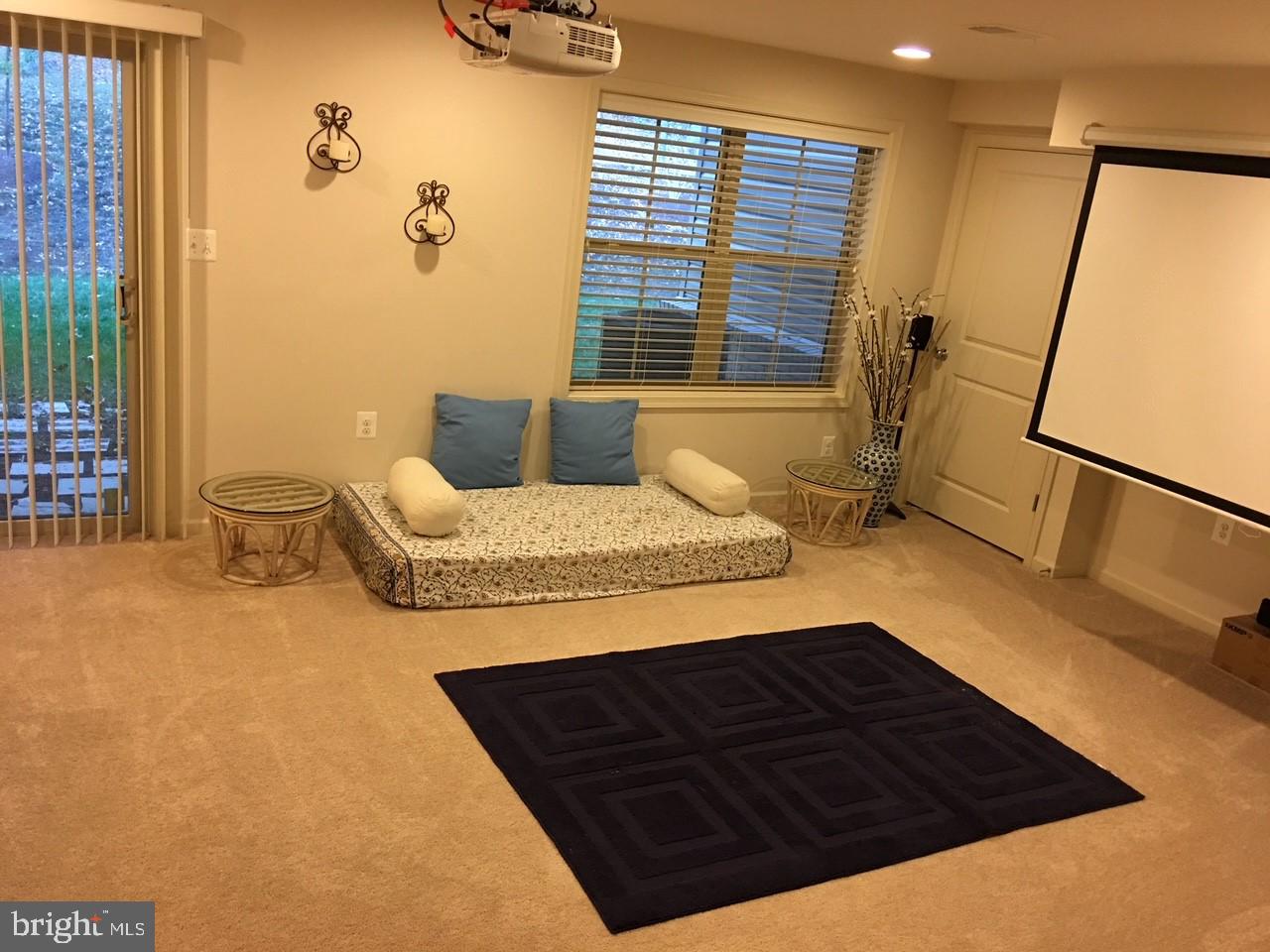 23337 Tradewind Drive Ashburn, VA 20148 - Photo 22 of 28 a bedroom with a bed window and couch