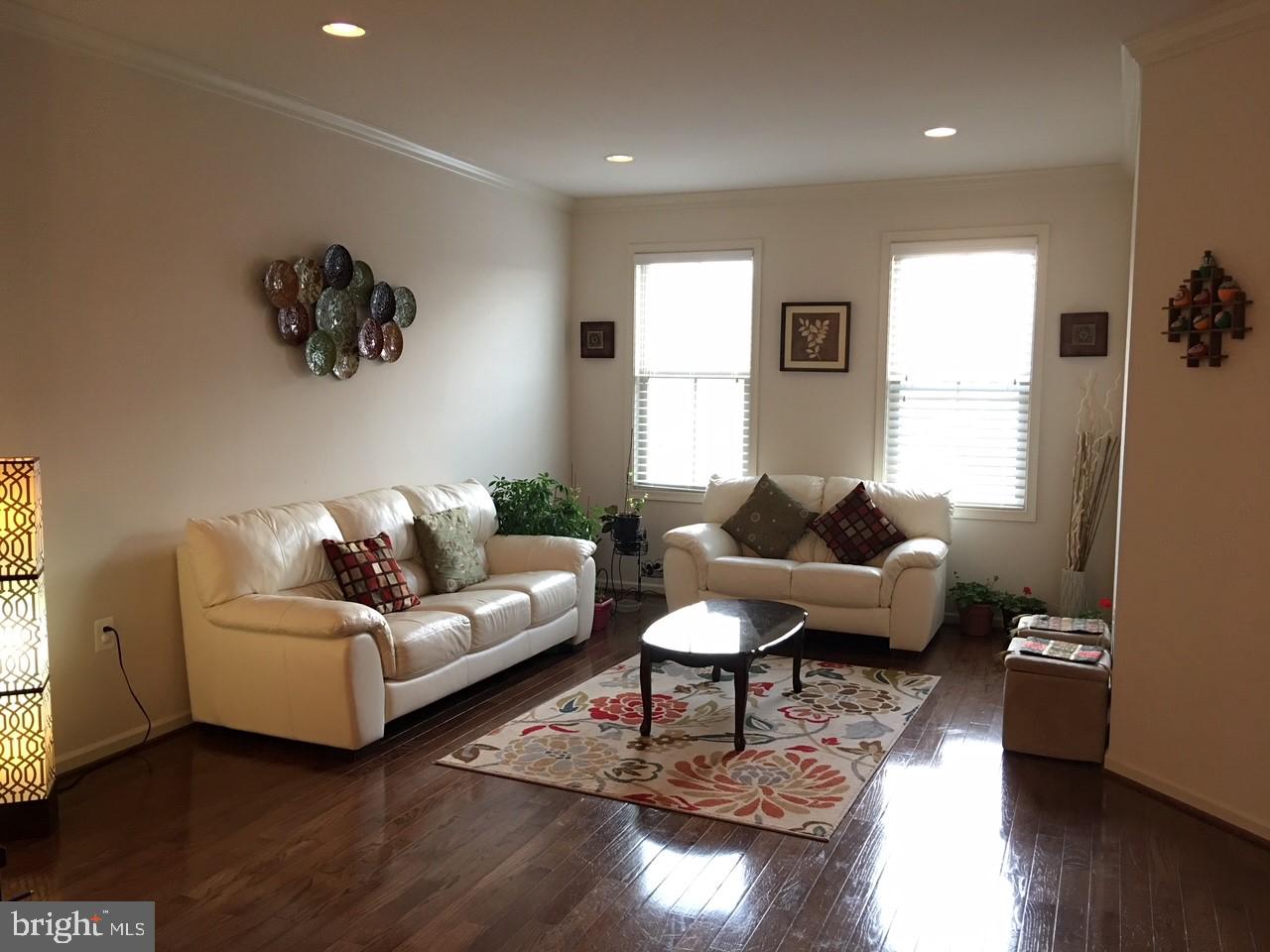 23337 Tradewind Drive Ashburn, VA 20148 - Photo 9 of 28 a living room with furniture wooden floor and a window