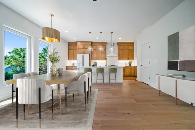 a view of a dining room with furniture window and outside view