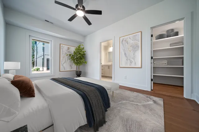 a bedroom with a bed and a cabinets