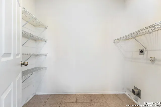 a view of a porch with chairs and backyard