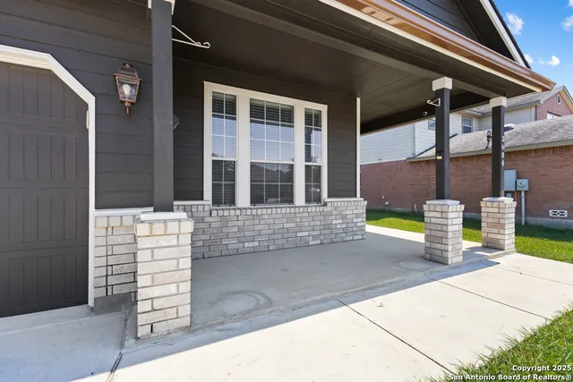 a view of the house with a outdoor seating