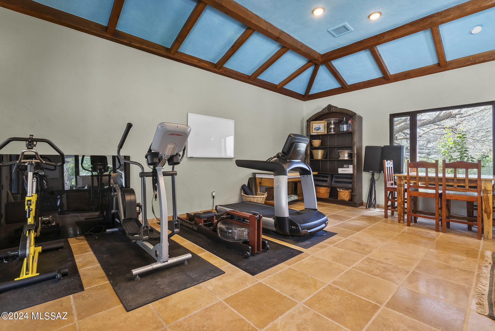 45 Clark Crossing Road Tumacacori, AZ 85640 - Photo 24 of 50 a room with gym equipment and a large window