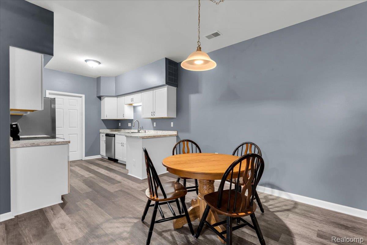 1150 Rial Lake Drive Howell, MI 48843 - Photo 10 of 24 Dining Room open to Kitchen and living room.