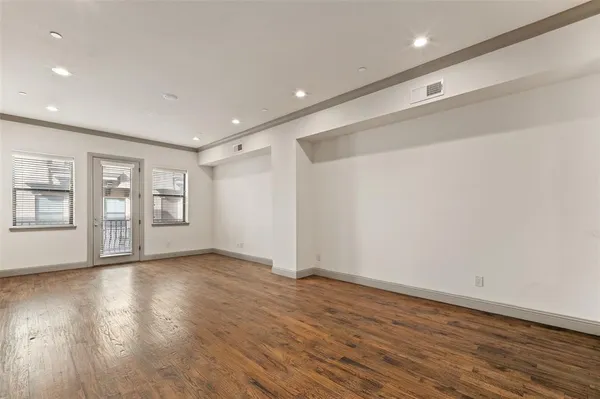 a view of kitchen and hall with wooden floor