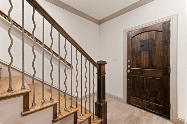 a view of an entryway with wooden floor