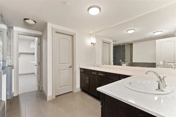 a bathroom with a tub and shower