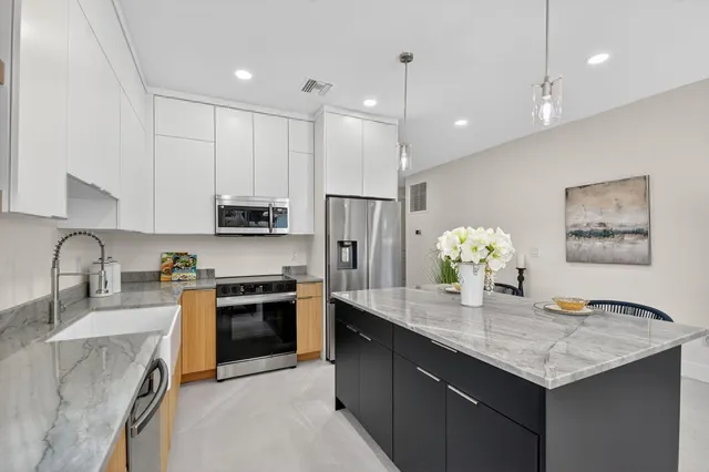 a kitchen with a table and chairs in it