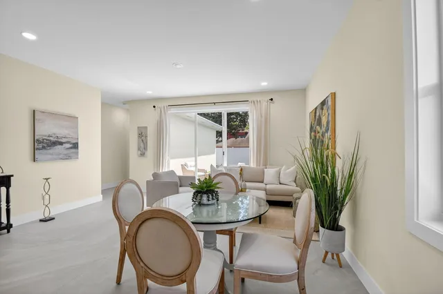 a bedroom with a bed and a potted plant