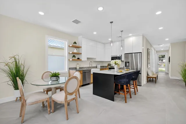 a living room with furniture and a lamp