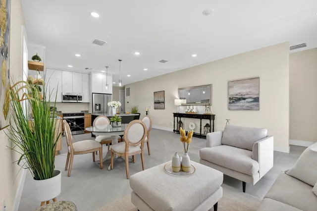 a bathroom with a sink and a potted plant