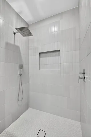 an aerial view of residential houses with outdoor space and trees all around