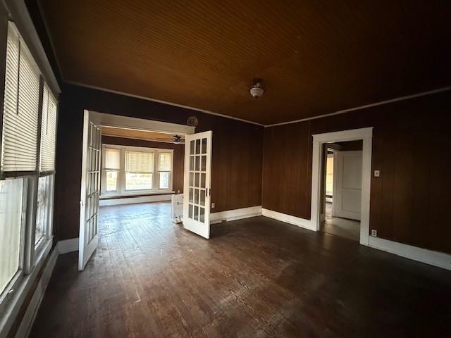 718 12th Street Southeast Paris, TX 75460 - Photo 8 of 20 an empty room with wooden floor and windows