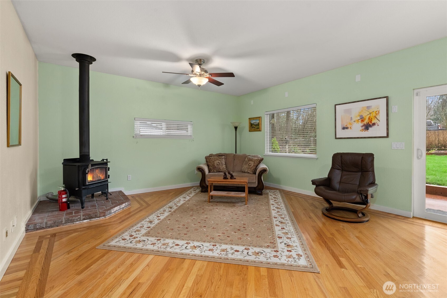 1105 Irving Street Southwest Tumwater, WA 98512 - Photo 12 of 38 a living room with furniture and a flat screen tv
