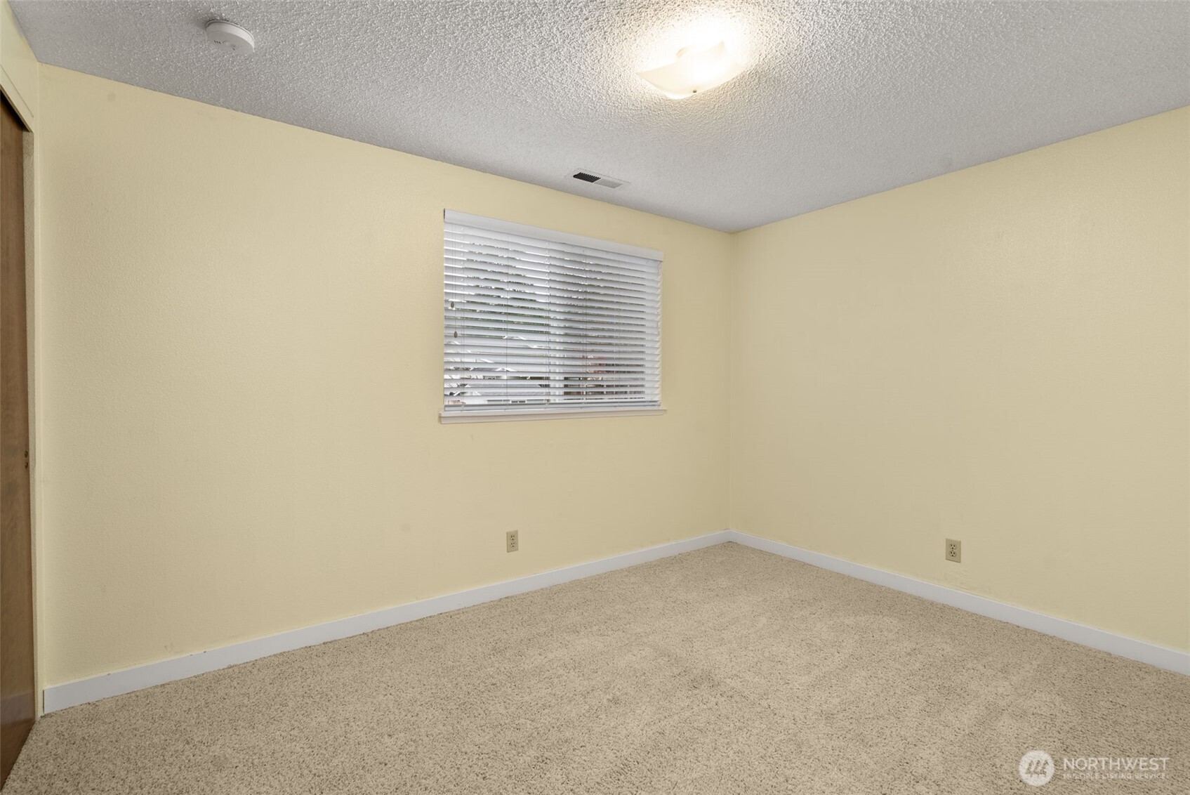 1105 Irving Street Southwest Tumwater, WA 98512 - Photo 19 of 38 an empty room with a window