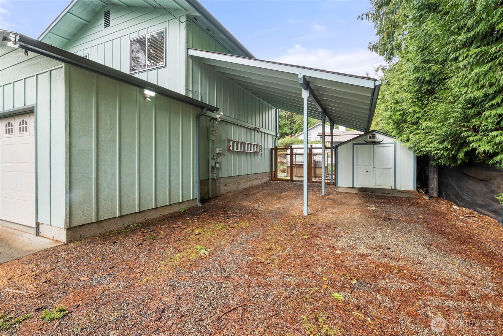 1105 Irving Street Southwest Tumwater, WA 98512 - Photo 29 of 38 a view of a house with a backyard and garage