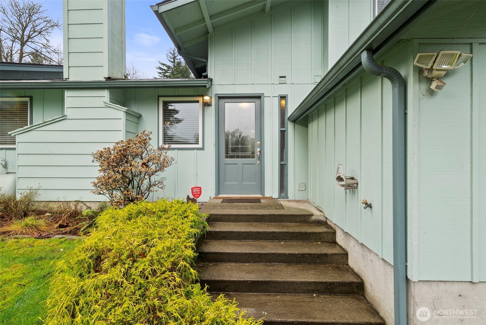 1105 Irving Street Southwest Tumwater, WA 98512 - Photo 3 of 38 a front view of a house with a garden