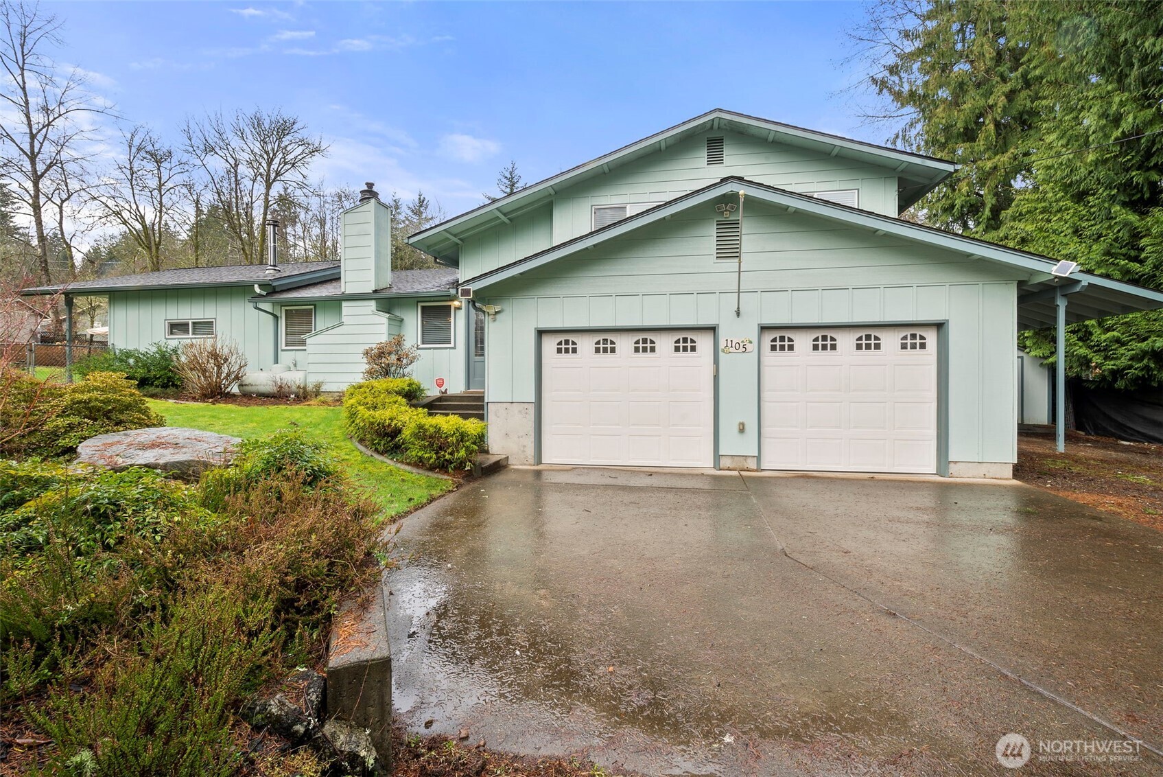 1105 Irving Street Southwest Tumwater, WA 98512 - Photo 37 of 38 a view of a house with a yard and garage