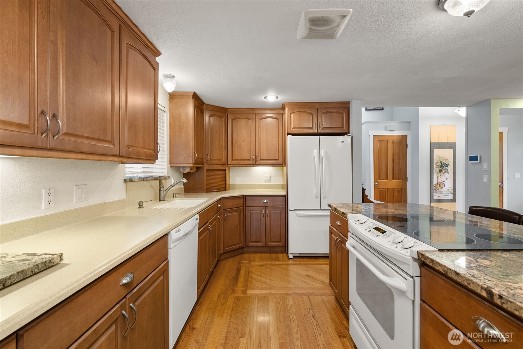 1105 Irving Street Southwest Tumwater, WA 98512 - Photo 10 of 38 a kitchen with a sink a stove and refrigerator