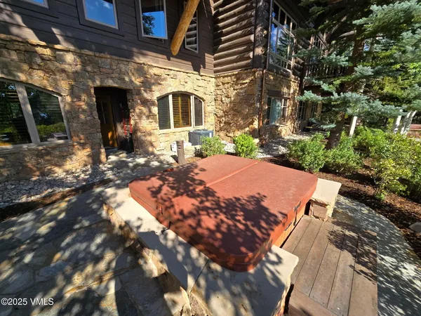a view of a patio with table and chairs and potted plants